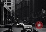 Image of busy city street with pedestrian traffic Detroit Michigan USA, 1926, second 57 stock footage video 65675030056