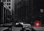 Image of busy city street with pedestrian traffic Detroit Michigan USA, 1926, second 58 stock footage video 65675030056
