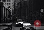 Image of busy city street with pedestrian traffic Detroit Michigan USA, 1926, second 59 stock footage video 65675030056
