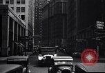 Image of busy city street with pedestrian traffic Detroit Michigan USA, 1926, second 60 stock footage video 65675030056