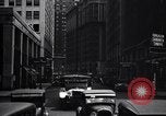 Image of busy city street with pedestrian traffic Detroit Michigan USA, 1926, second 61 stock footage video 65675030056
