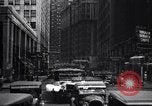 Image of busy city street with pedestrian traffic Detroit Michigan USA, 1926, second 62 stock footage video 65675030056