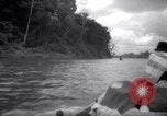 Image of natives in canoes Devil's Island French Guiana, 1939, second 4 stock footage video 65675030237