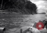 Image of natives in canoes Devil's Island French Guiana, 1939, second 11 stock footage video 65675030237