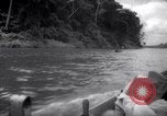 Image of natives in canoes Devil's Island French Guiana, 1939, second 12 stock footage video 65675030237