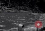 Image of natives in canoes Devil's Island French Guiana, 1939, second 15 stock footage video 65675030237