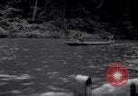 Image of natives in canoes Devil's Island French Guiana, 1939, second 16 stock footage video 65675030237
