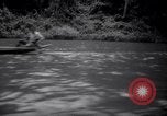 Image of natives in canoes Devil's Island French Guiana, 1939, second 19 stock footage video 65675030237