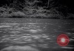 Image of natives in canoes Devil's Island French Guiana, 1939, second 20 stock footage video 65675030237