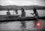 Image of natives in canoes Devil's Island French Guiana, 1939, second 27 stock footage video 65675030237
