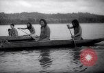 Image of natives in canoes Devil's Island French Guiana, 1939, second 28 stock footage video 65675030237