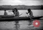 Image of natives in canoes Devil's Island French Guiana, 1939, second 30 stock footage video 65675030237