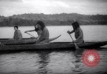 Image of natives in canoes Devil's Island French Guiana, 1939, second 31 stock footage video 65675030237