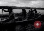 Image of natives in canoes Devil's Island French Guiana, 1939, second 32 stock footage video 65675030237
