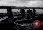 Image of natives in canoes Devil's Island French Guiana, 1939, second 33 stock footage video 65675030237