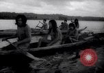 Image of natives in canoes Devil's Island French Guiana, 1939, second 35 stock footage video 65675030237