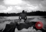Image of natives in canoes Devil's Island French Guiana, 1939, second 37 stock footage video 65675030237