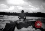 Image of natives in canoes Devil's Island French Guiana, 1939, second 38 stock footage video 65675030237