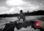 Image of natives in canoes Devil's Island French Guiana, 1939, second 39 stock footage video 65675030237