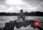 Image of natives in canoes Devil's Island French Guiana, 1939, second 41 stock footage video 65675030237