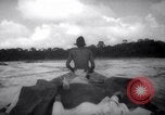 Image of natives in canoes Devil's Island French Guiana, 1939, second 42 stock footage video 65675030237