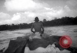 Image of natives in canoes Devil's Island French Guiana, 1939, second 43 stock footage video 65675030237