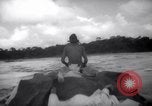 Image of natives in canoes Devil's Island French Guiana, 1939, second 44 stock footage video 65675030237
