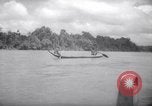 Image of natives in canoes Devil's Island French Guiana, 1939, second 49 stock footage video 65675030237