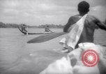Image of natives in canoes Devil's Island French Guiana, 1939, second 50 stock footage video 65675030237