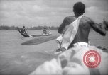 Image of natives in canoes Devil's Island French Guiana, 1939, second 52 stock footage video 65675030237