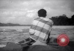 Image of natives in canoes Devil's Island French Guiana, 1939, second 57 stock footage video 65675030237