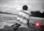 Image of natives in canoes Devil's Island French Guiana, 1939, second 58 stock footage video 65675030237