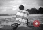 Image of natives in canoes Devil's Island French Guiana, 1939, second 59 stock footage video 65675030237