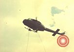 Image of helicopter rappel Ankhe South Vietnam, 1966, second 5 stock footage video 65675030382