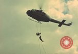Image of helicopter rappel Ankhe South Vietnam, 1966, second 8 stock footage video 65675030382