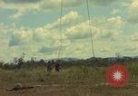 Image of helicopter rappel Ankhe South Vietnam, 1966, second 15 stock footage video 65675030382