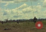 Image of helicopter rappel Ankhe South Vietnam, 1966, second 19 stock footage video 65675030382