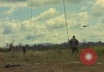 Image of helicopter rappel Ankhe South Vietnam, 1966, second 21 stock footage video 65675030382