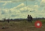 Image of helicopter rappel Ankhe South Vietnam, 1966, second 22 stock footage video 65675030382