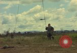 Image of helicopter rappel Ankhe South Vietnam, 1966, second 23 stock footage video 65675030382