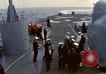 Image of HUS1 UH-34D Seahorse lands on USS North Hampton Atlantic Ocean, 1962, second 12 stock footage video 65675030397