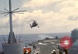 Image of HUS1 UH-34D Seahorse lands on USS North Hampton Atlantic Ocean, 1962, second 13 stock footage video 65675030397