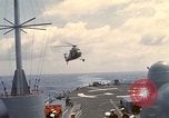 Image of HUS1 UH-34D Seahorse lands on USS North Hampton Atlantic Ocean, 1962, second 14 stock footage video 65675030397