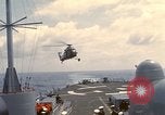 Image of HUS1 UH-34D Seahorse lands on USS North Hampton Atlantic Ocean, 1962, second 15 stock footage video 65675030397