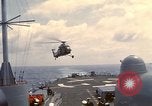 Image of HUS1 UH-34D Seahorse lands on USS North Hampton Atlantic Ocean, 1962, second 16 stock footage video 65675030397