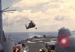 Image of HUS1 UH-34D Seahorse lands on USS North Hampton Atlantic Ocean, 1962, second 17 stock footage video 65675030397