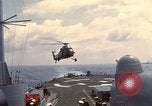 Image of HUS1 UH-34D Seahorse lands on USS North Hampton Atlantic Ocean, 1962, second 18 stock footage video 65675030397