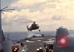 Image of HUS1 UH-34D Seahorse lands on USS North Hampton Atlantic Ocean, 1962, second 20 stock footage video 65675030397
