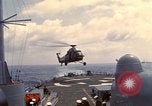 Image of HUS1 UH-34D Seahorse lands on USS North Hampton Atlantic Ocean, 1962, second 21 stock footage video 65675030397