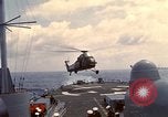 Image of HUS1 UH-34D Seahorse lands on USS North Hampton Atlantic Ocean, 1962, second 22 stock footage video 65675030397